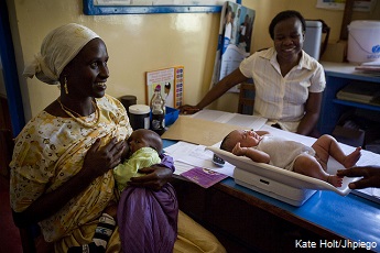 A mother Brings her young baby to see a midwife for a check up in the town of Garba Tulla, Eastern Province, Kenya