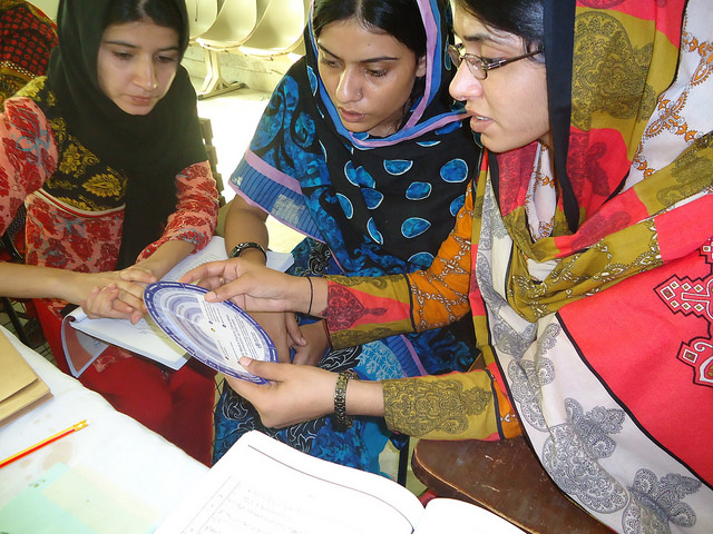 Women in Pakistan using a partograph to build their skills as skilled birth attendants