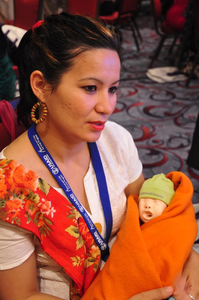 HBS Dhaka workshop attendee with an educational mannequin.