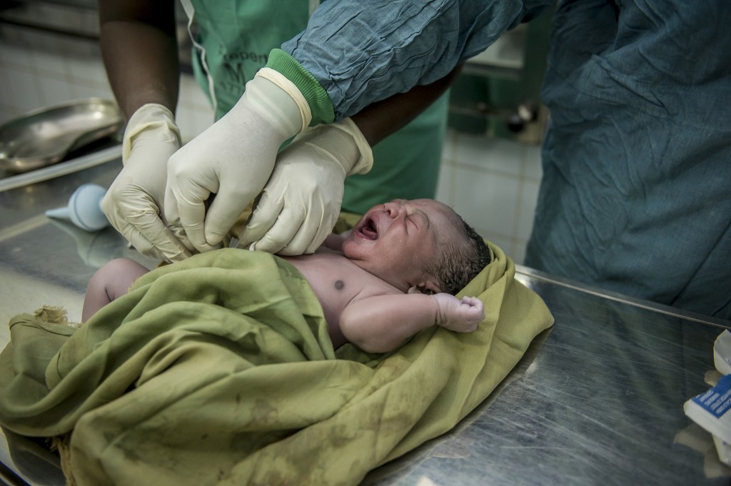 Newly delivered baby being cared for by midwives in Ghana.