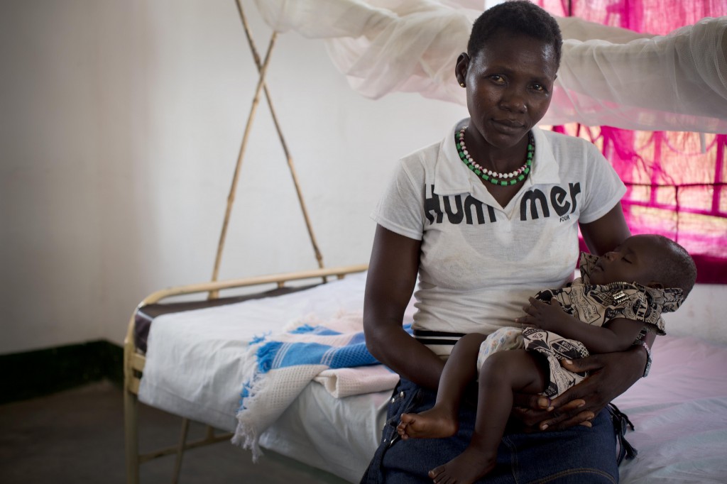 Mother holds her baby in Lanyi Health Centre, in Mundri East County South Sudan