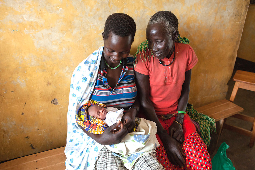 Above: Grandmother and first time mother with newborn in Uganda. (Guido Dingemans/Jhpiego)