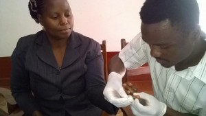 Nurse Marwa draws blood from a fellow participant during MCSP's training