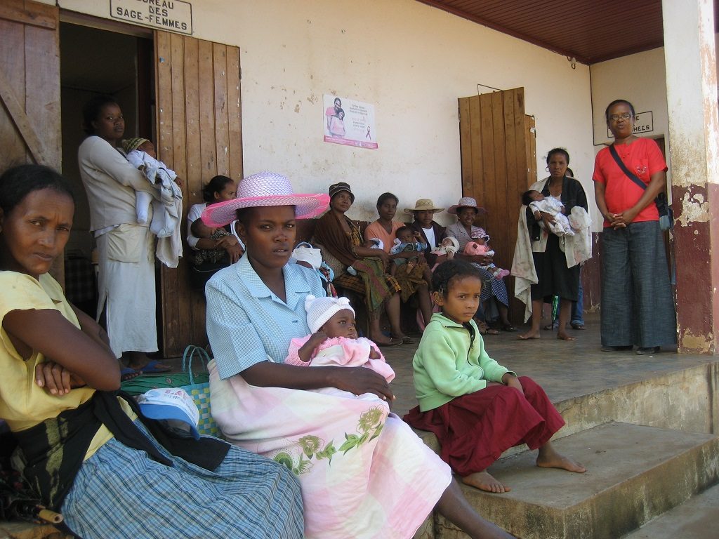 Mothers waiting for postnatal care at a clinic in Madagascar