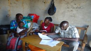 Caregiver providing feedback on services provided by the CHV in Nyaguda Community to the MCSP and MoH staff.