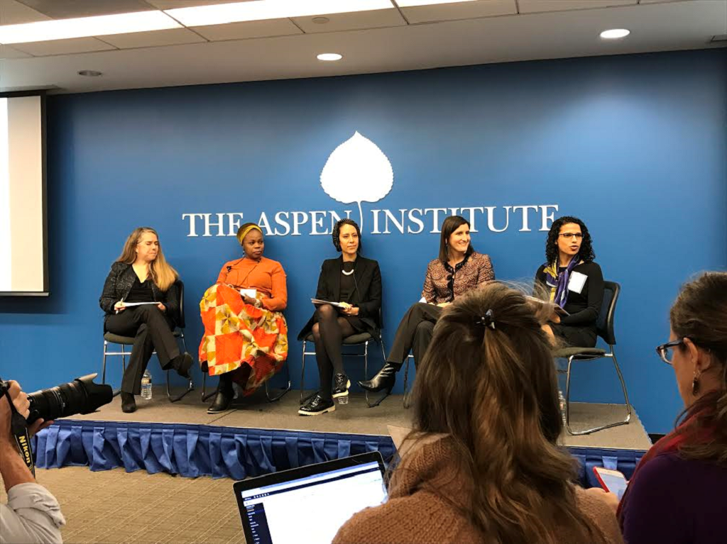 Panelists at event sitting on stage
