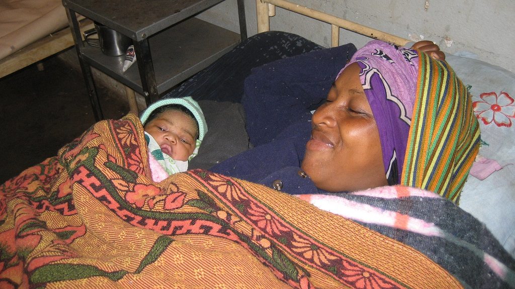 Mother and baby resting after delivery in Madagascar.