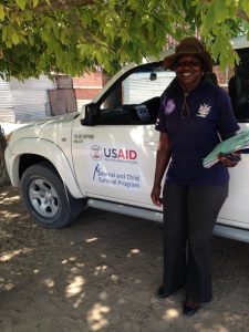 Bernadine standing outside beside a truck