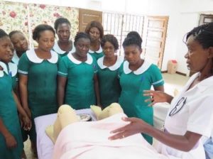 Gifty Baidoo demonstrates normal labor and delivery procedures to her midwifery students at Korle Bu.