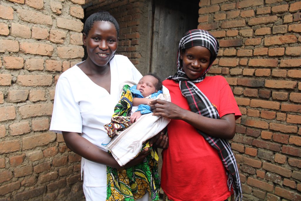 Odette Banzubaze with midwife Agnes Mukampeta who saved her life.
