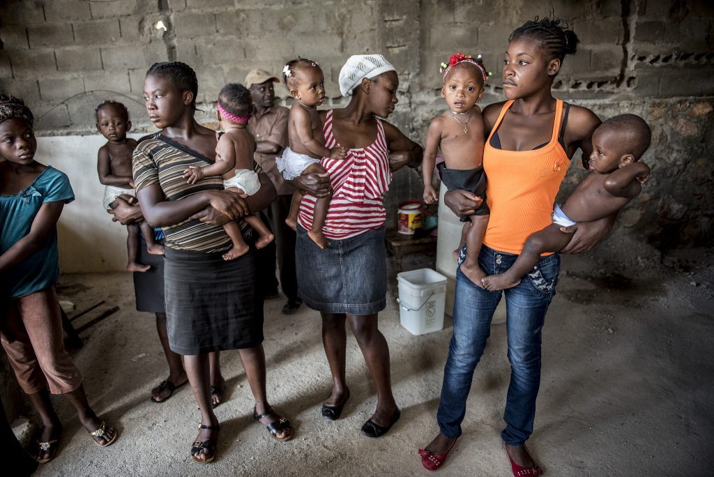 Haitian women in a group holding babies