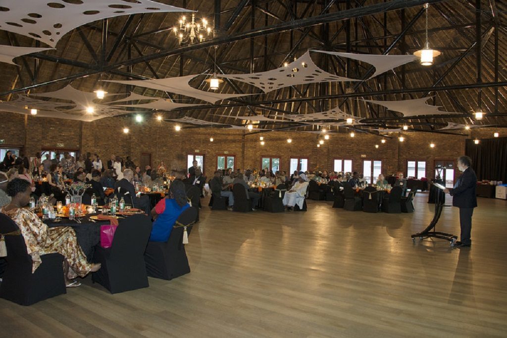 Attendees sitting at tables at ICHC