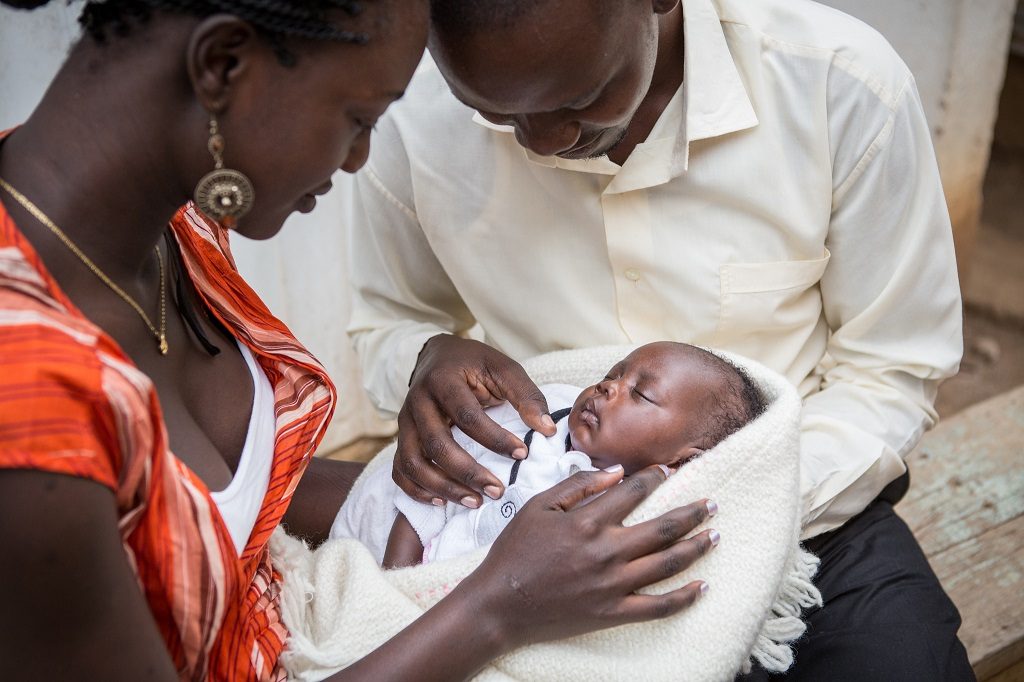 Kenyan parents with their six-week-old baby.