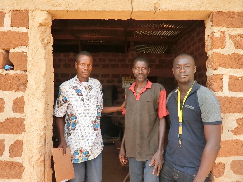 Above: Loukou Kouame with community health workers at his home in Djangokro, Cote d’Ivoire.