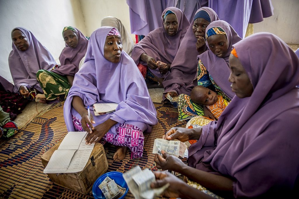 Members of the Mada Saving Club for women in Nigeria contribute money weekly for members to borrow when they need it.
