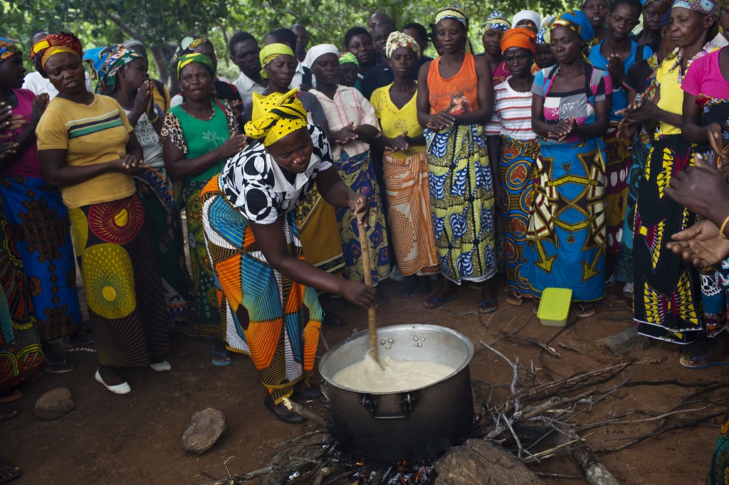 Women attend a cooking demonstration on how to cook nutritious food with locally available and inexpensive ingredients in Nampula, Mozambique.