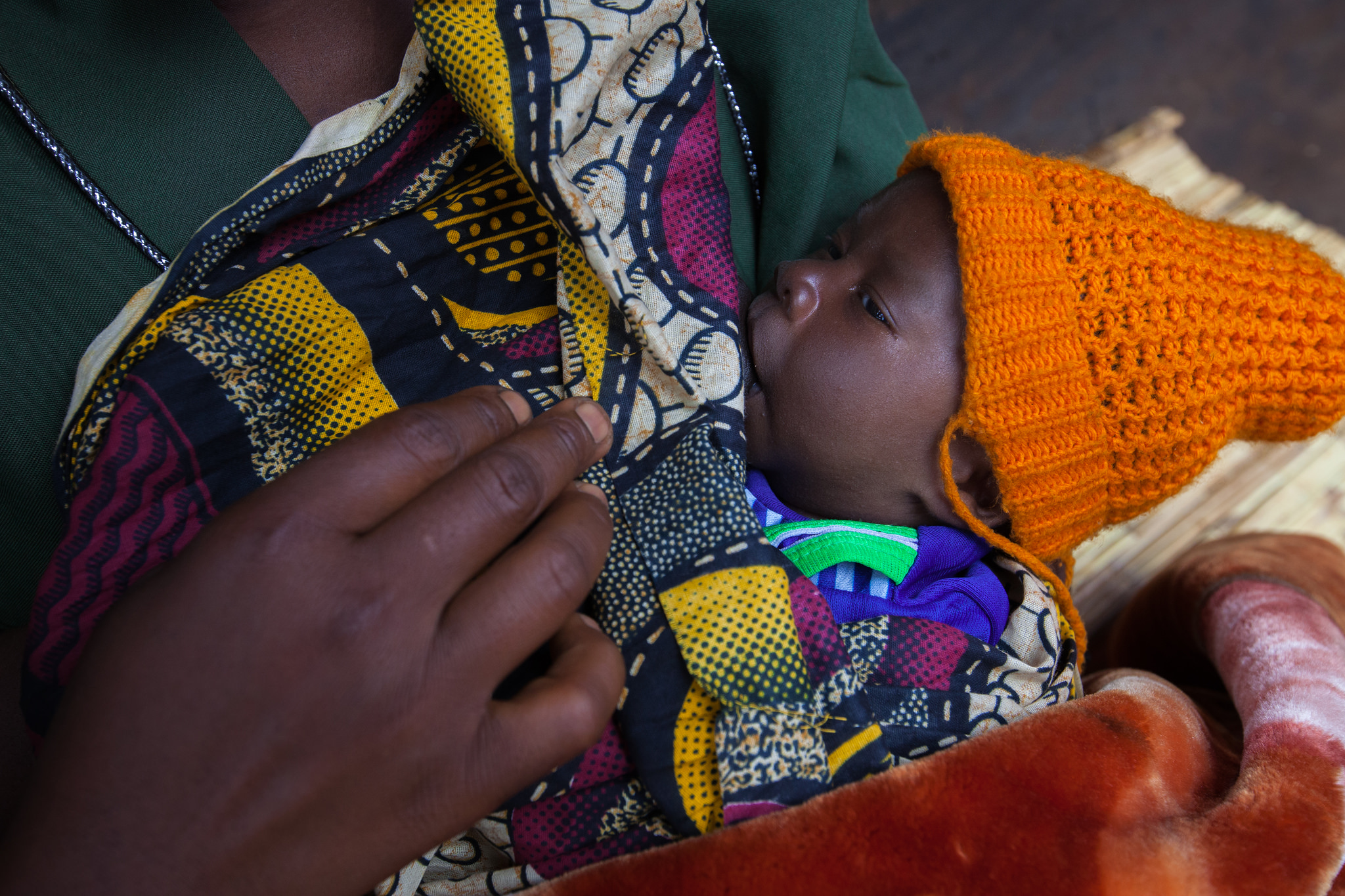 Baby breastfeeding in Malawi. (Courtesy of Guido Dingemans/Jhpiego)