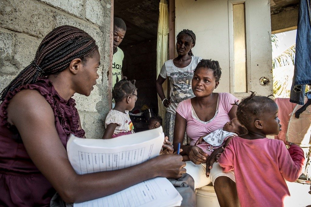 Josiane Pierre meets with Rosemeline Milord during a house call.