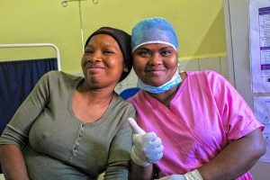 After completing a successful procedure, Midwife Sitraka gives a thumbs-up to Mamy’s comment about her implant being “the best family planning method for me.”