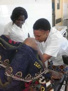 Above: Fátima Cobre assisting a woman in labor at Nacala Porto District Hospital.