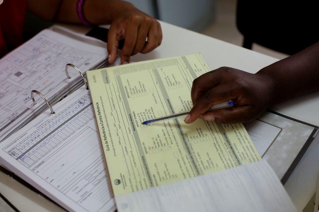Mozambican nurses doing paperwork.
