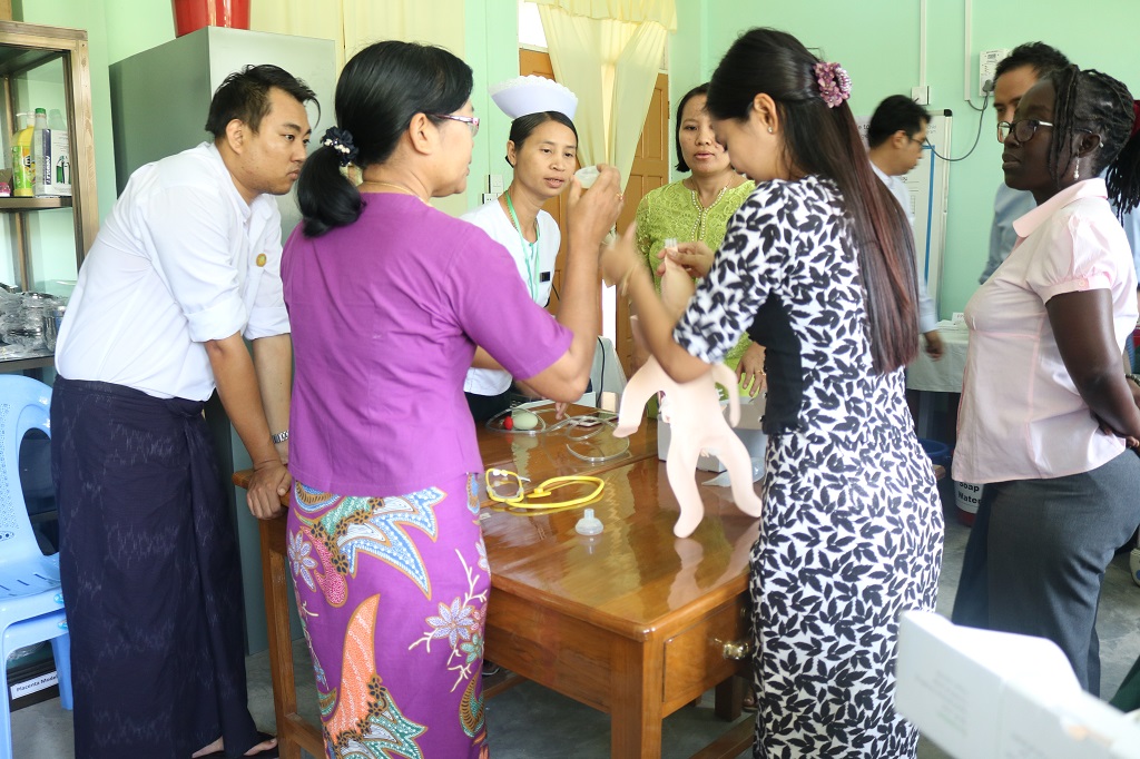 A skills lab management team practices how to assemble the simulation models during a Skills Lab Coordinator Workshop at Pathein L&PIC, Ayeyarwady Region.