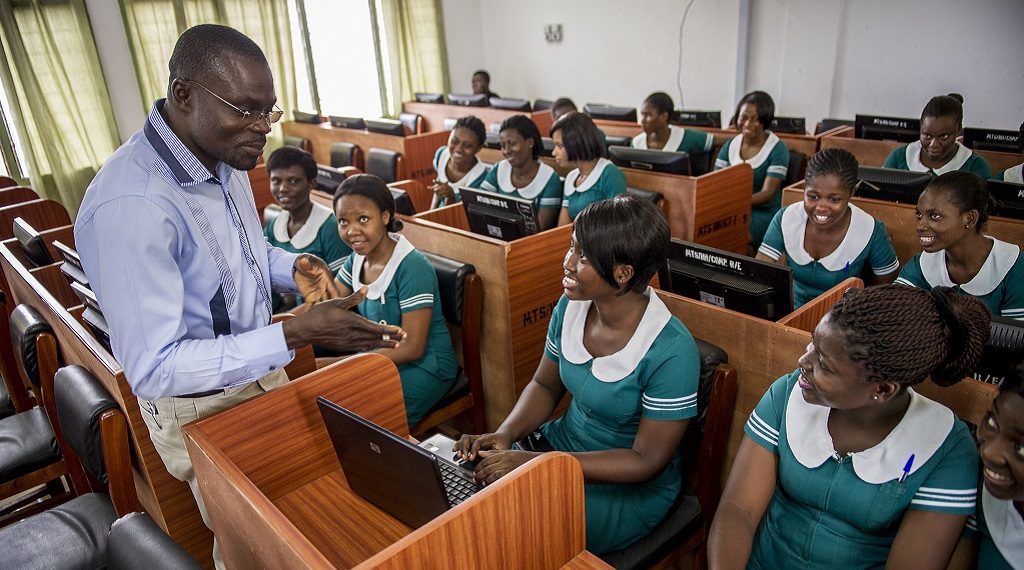 Midwifery students in Hohoe, Ghana, listen to their instructor.