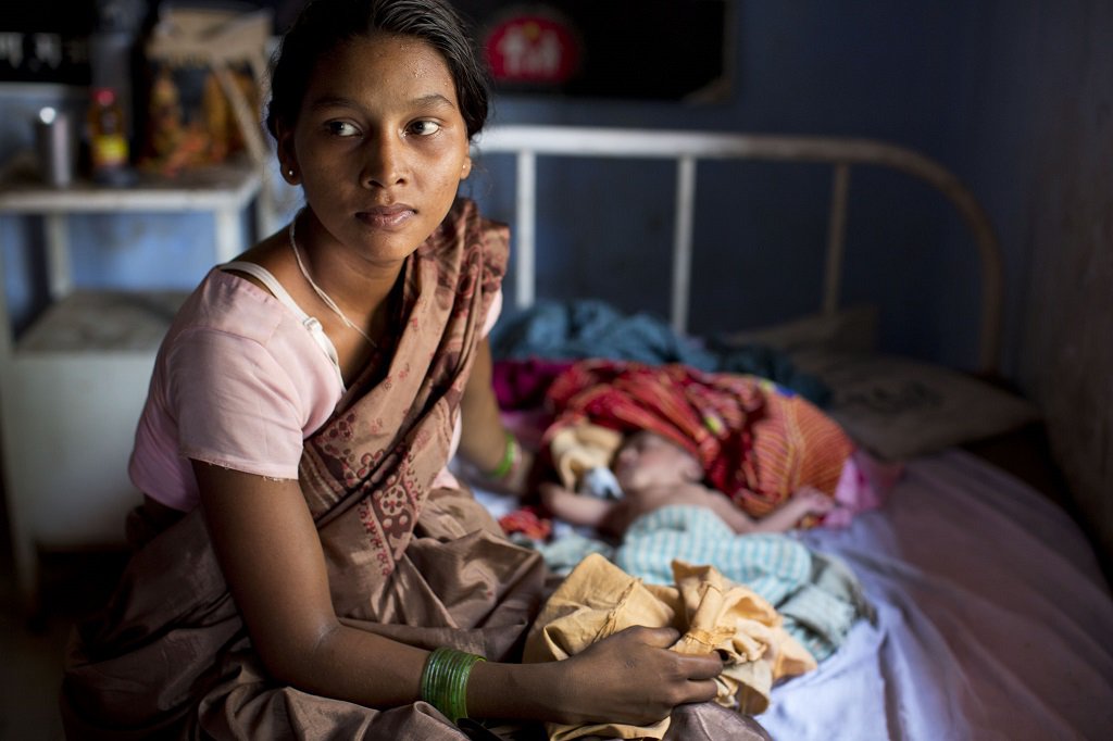 Mother and newborn at Kolibera Health Center near Ranchi, India.