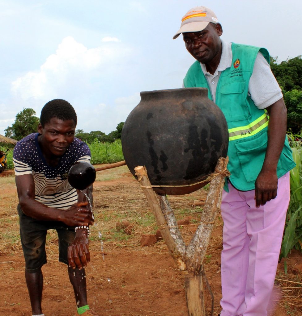 Learning proper handwashing at a traditional tippy tap.