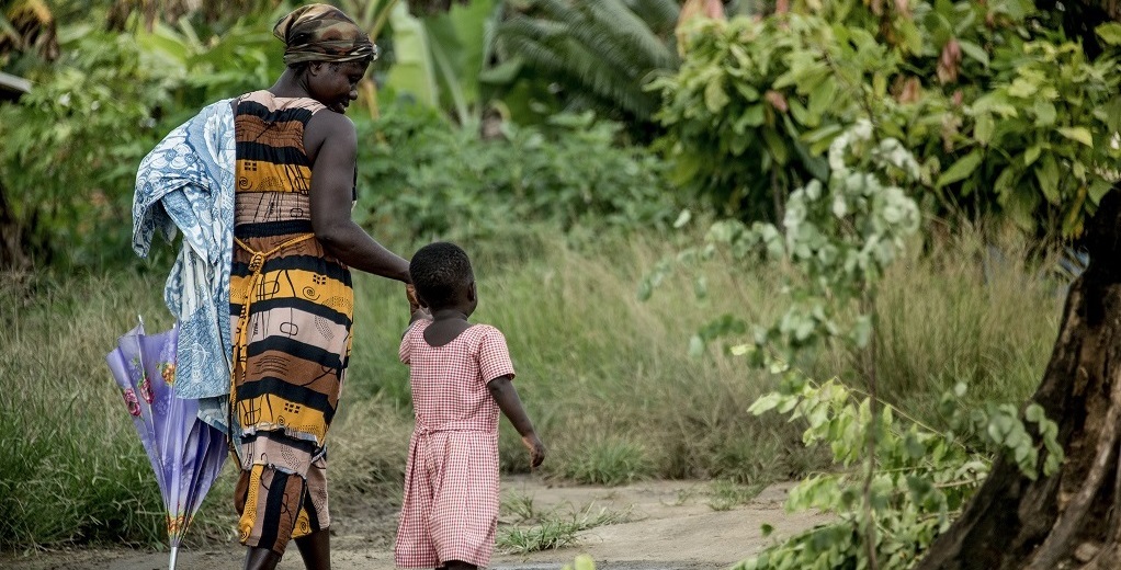 Mother and daughter walk in Ghana