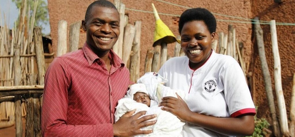 Jean d’Amour, Laurence, and their newborn, Yvan.