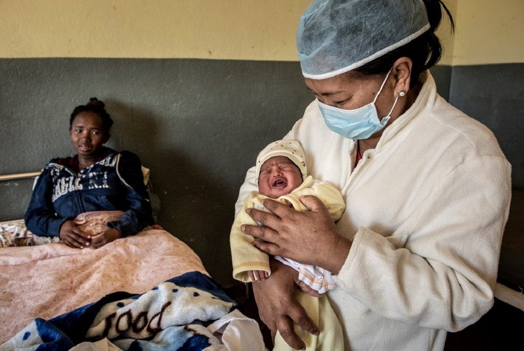 Mother, midwife and one-day-old baby in Madagascar