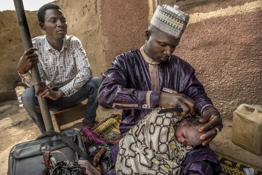 Barber Abdulaziz Lawn shaves Abubakar Nafisatu's hair