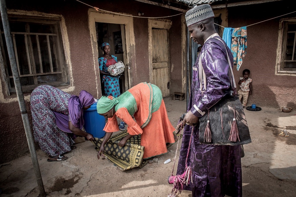 Abdulaziz Lawn arrives to the home of Nafisatu Bilyaminu in Wandi village