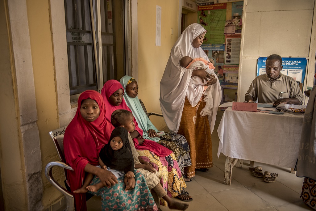 The barber prepares the newborn’s referral card