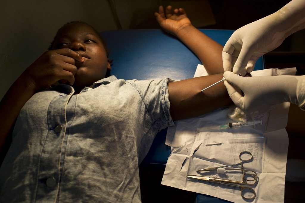 Implant being administered to young woman in Burkina Faso