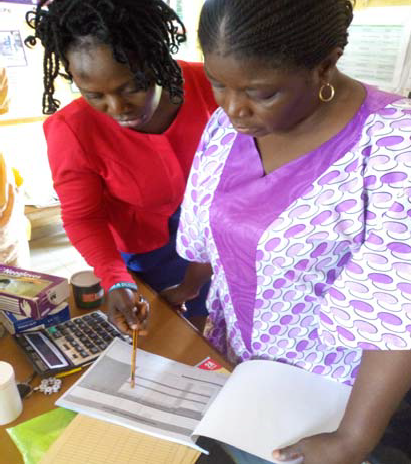 A Logistics Management Coordinating Unit staff member mentors a service provider