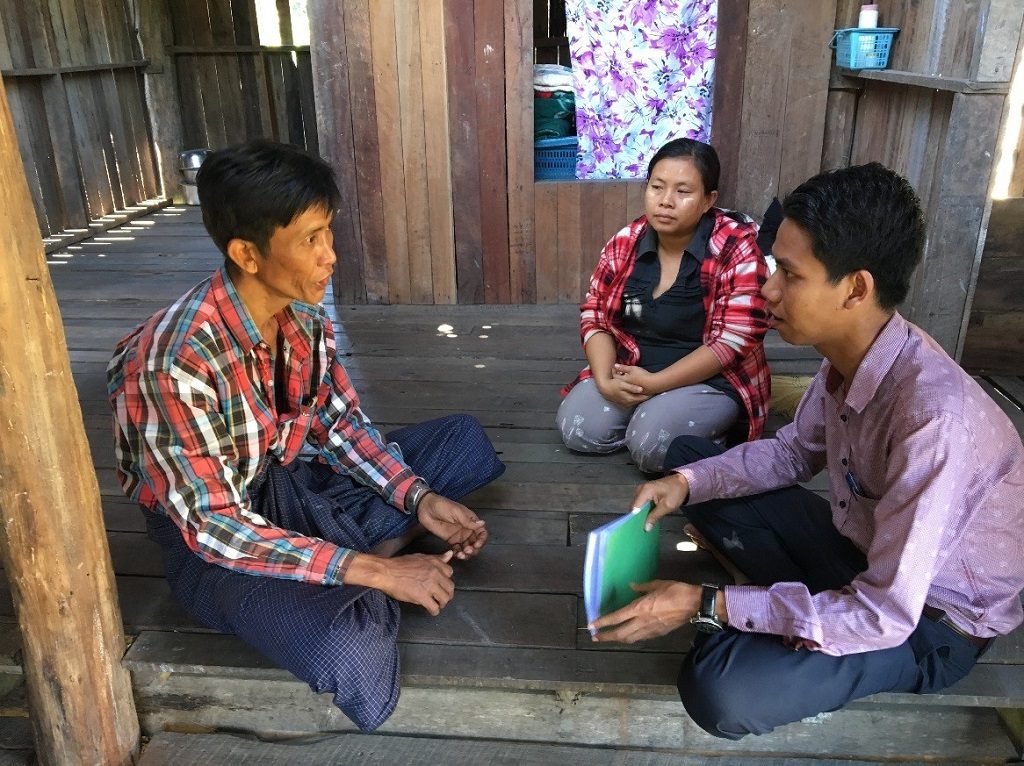 Ko Maung Tun speaking with MCSP-trained ICMVs, Dr. Thu Naing and Nan Nyein Nyein Ei, about his TB diagnosis and the support he received from Ei.