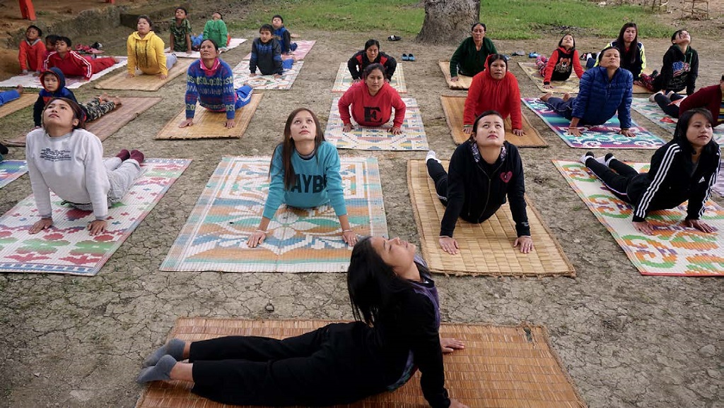 Kiran Hidam leads a yoga class
