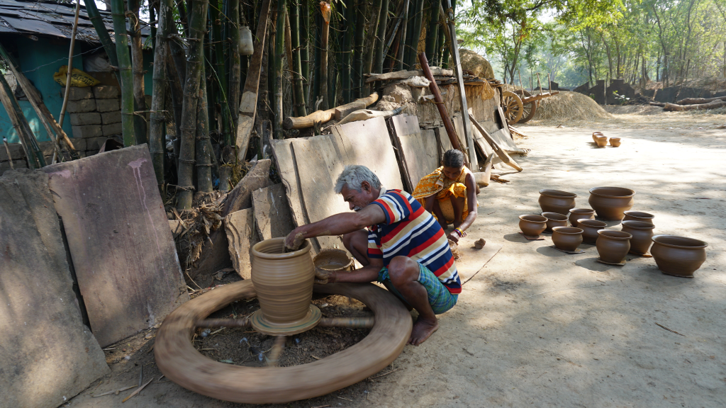 Husband and wife Baisakhi and Samaru Kumkar make clay pots, flower vases, and oil lamps at their home.