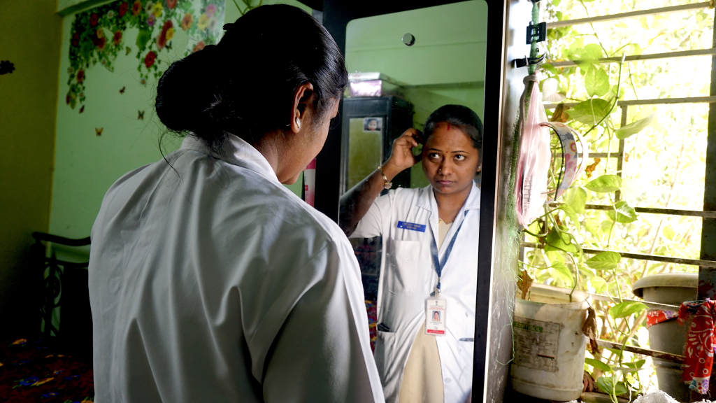 Rekha getting ready for the day.