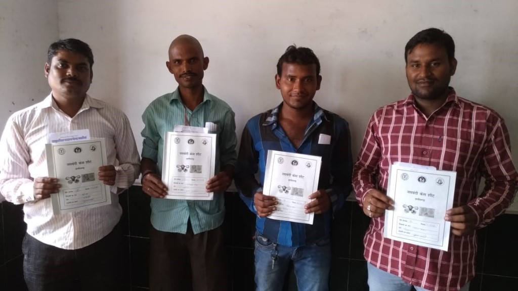 Men who have undergone NSV at an MCSP-supported facility proudly show their paperwork.
