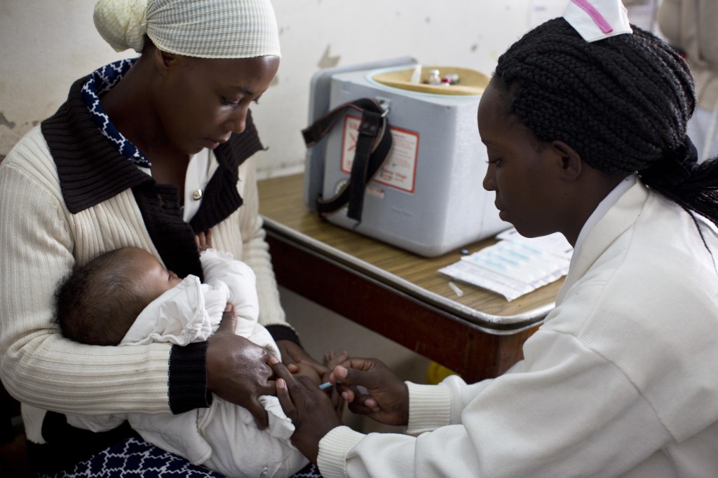 A child receives a vaccine at a health center in Ishaka Mberare, Uganda.