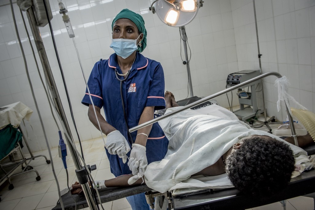 Female health worker with patient