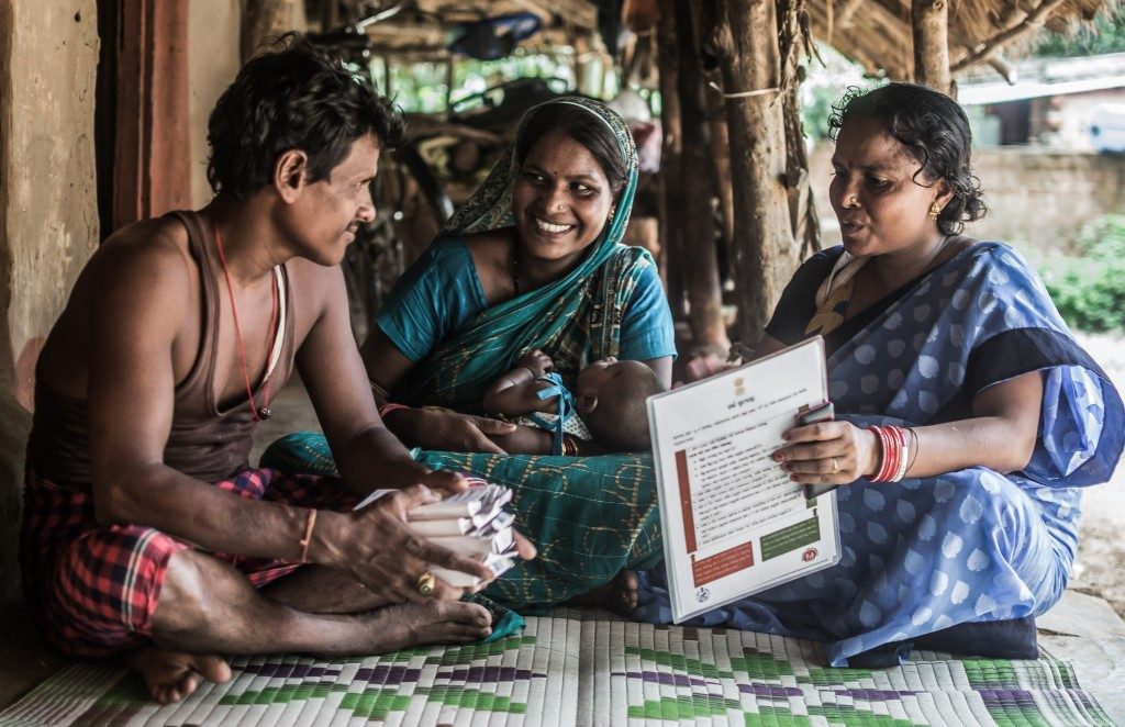 Married couple Jyoti Rani and Pratap Patra meet with Lakshmi Demi, the local community health worker, to discuss family planning options.