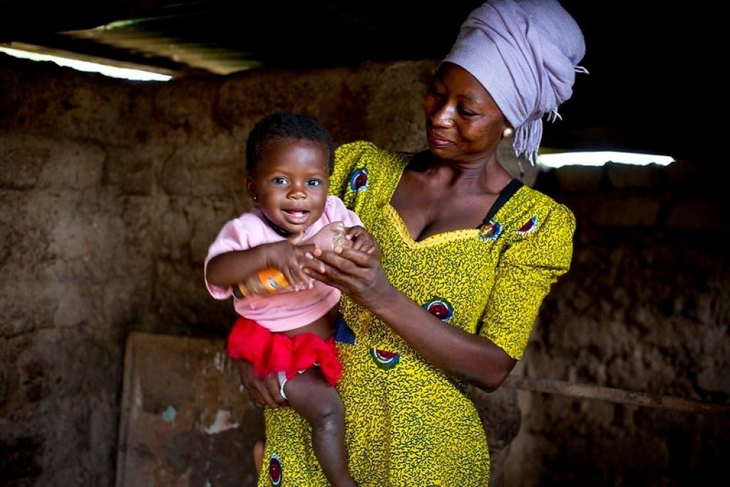 Happy looking mother holding child